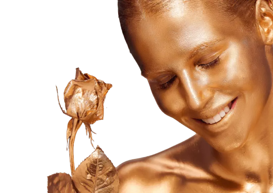 woman covered with gold paint holding rose